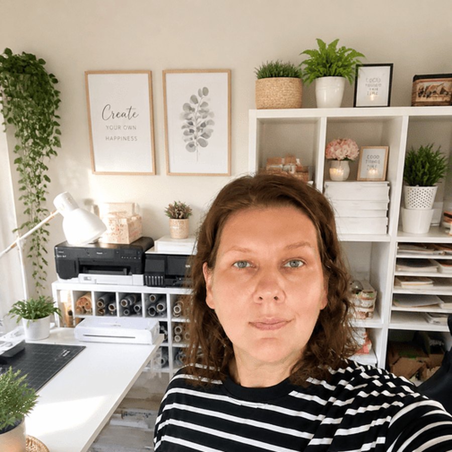 Natali in her studio, smiling at the camera